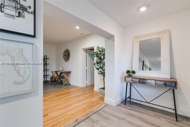 corridor featuring hardwood / wood-style flooring