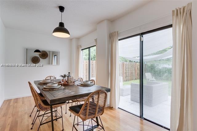 dining area featuring light wood-type flooring