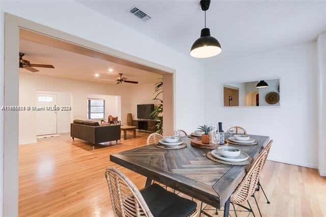 dining area featuring light wood-type flooring and ceiling fan