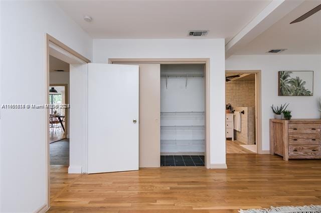 bedroom featuring a closet, ceiling fan, and hardwood / wood-style floors