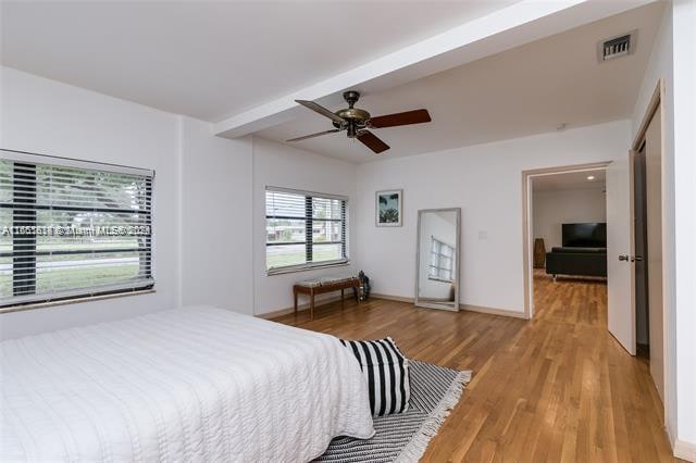 bedroom featuring light hardwood / wood-style flooring and ceiling fan