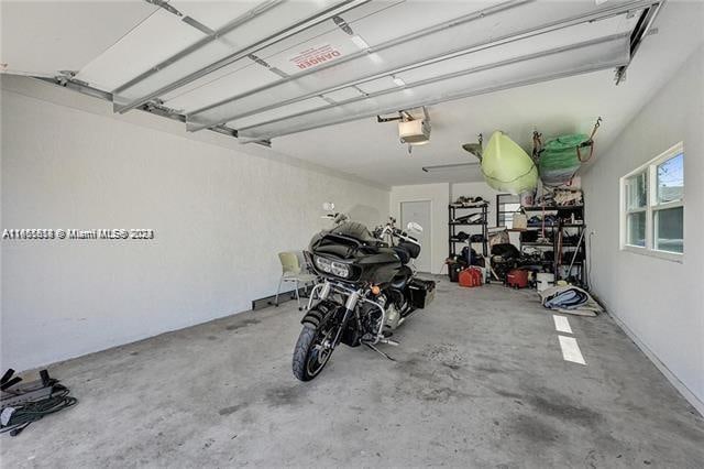 garage featuring a garage door opener