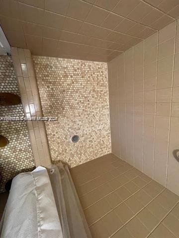 bathroom featuring tile walls and tile patterned flooring