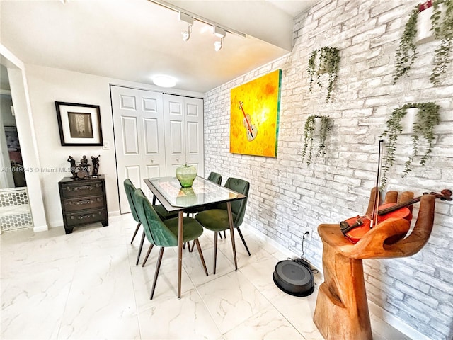 dining room featuring track lighting