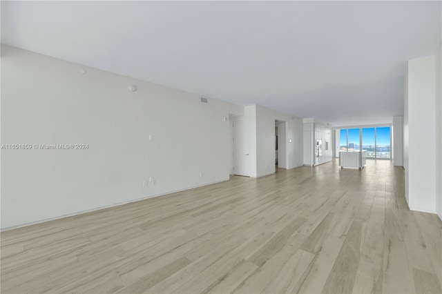 spare room featuring light wood-type flooring