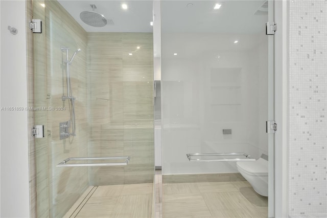 bathroom featuring tile walls, tile patterned flooring, walk in shower, and toilet