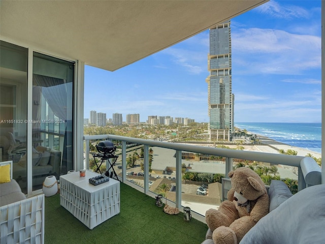 balcony with a view of the beach and a water view