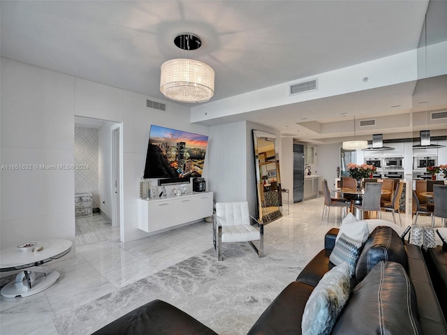 living room with a tray ceiling