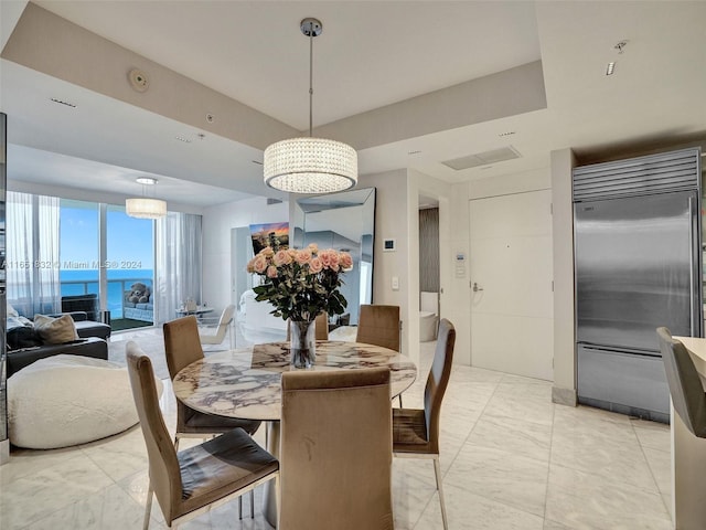 dining room featuring a water view