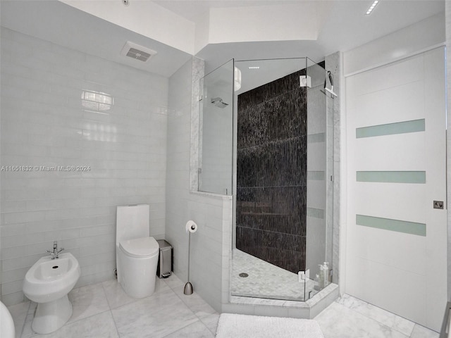 bathroom featuring tile walls, toilet, an enclosed shower, and a bidet