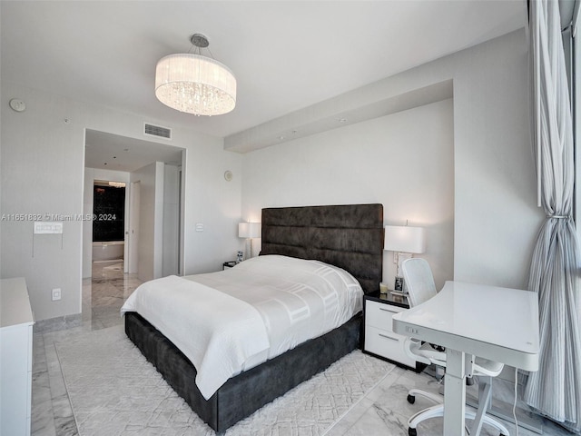 bedroom featuring a notable chandelier