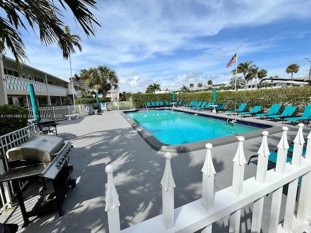 view of pool with a patio area and area for grilling