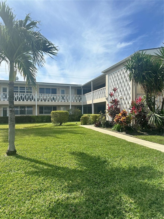 view of home's community with a lawn