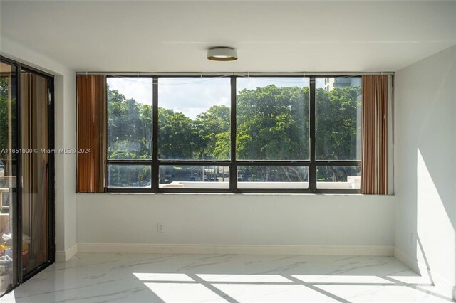 unfurnished room with a wealth of natural light