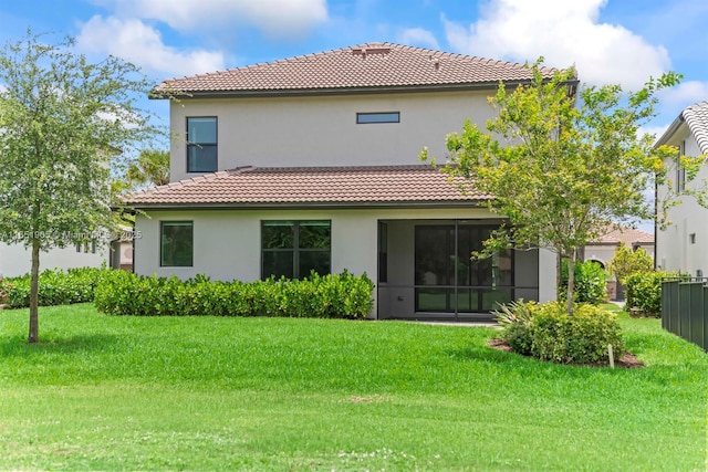8123 NW 78th St, Tamarac, FL 33321 - rear view of house featuring a tile roof, stucco siding, and a yard
