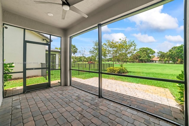 8123 NW 78th St, Tamarac, FL 33321 - unfurnished sunroom featuring a ceiling fan