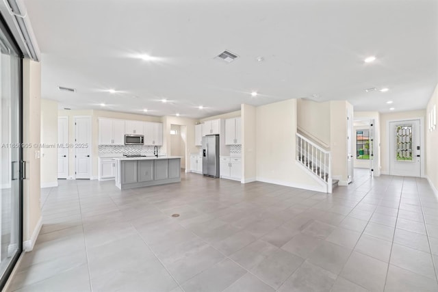 8123 NW 78th St, Tamarac, FL 33321 - unfurnished living room featuring stairway, recessed lighting, and light tile patterned floors
