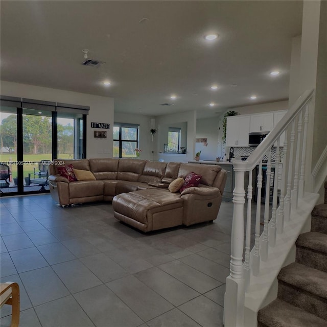 8123 NW 78th St, Tamarac, FL 33321 - living room featuring light tile patterned floors, stairway, and recessed lighting