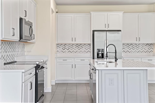 8123 NW 78th St, Tamarac, FL 33321 - kitchen featuring appliances with stainless steel finishes, light countertops, tasteful backsplash, and light tile patterned floors