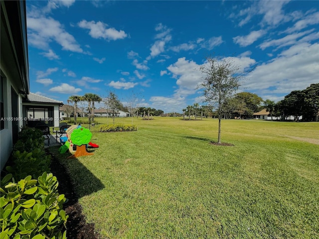 8123 NW 78th St, Tamarac, FL 33321 - view of green lawn featuring a patio