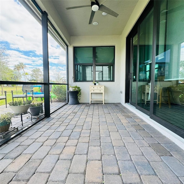 8123 NW 78th St, Tamarac, FL 33321 - unfurnished sunroom with a ceiling fan