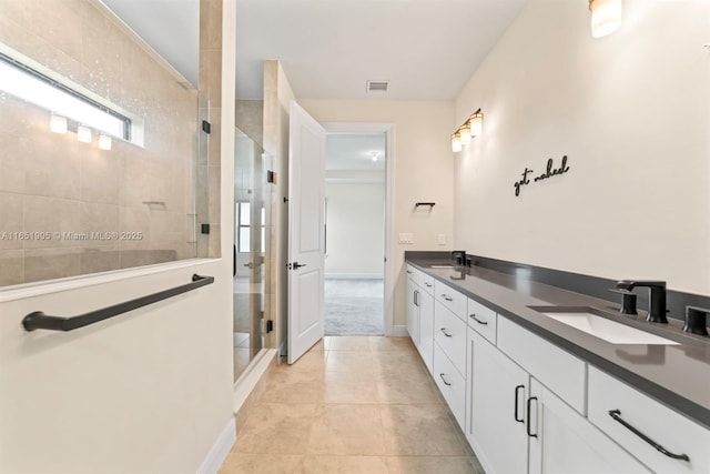 8123 NW 78th St, Tamarac, FL 33321 - full bathroom with a shower stall, double vanity, and tile patterned floors