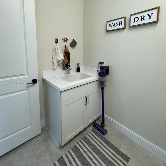 8123 NW 78th St, Tamarac, FL 33321 - bathroom featuring baseboards, vanity, and tile patterned flooring