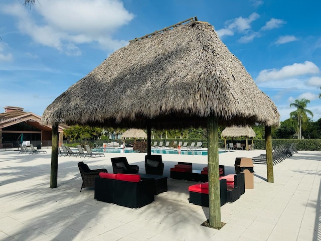 8123 NW 78th St, Tamarac, FL 33321 - view of property's community featuring a gazebo, a swimming pool, and a patio area