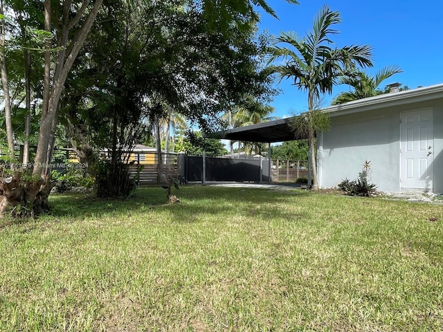 view of yard with a carport