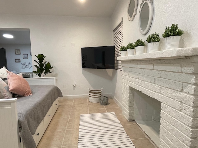 bedroom with light tile patterned floors