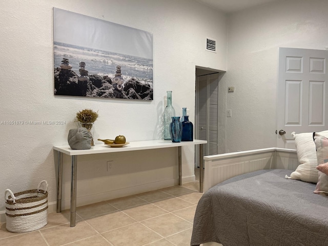 bedroom featuring light tile patterned flooring