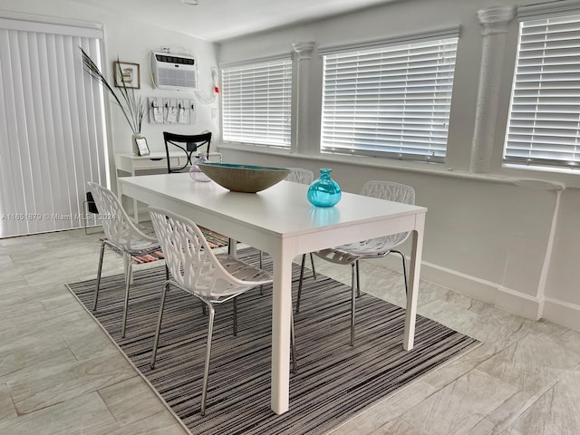 dining area with an AC wall unit