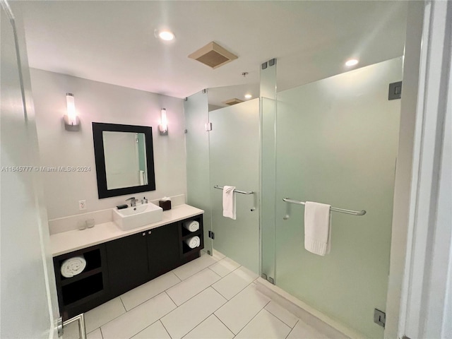 bathroom featuring a shower stall, vanity, and tile patterned flooring