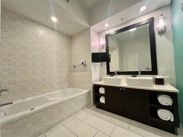 bathroom with double vanity, a sink, tile patterned flooring, and a relaxing tiled tub
