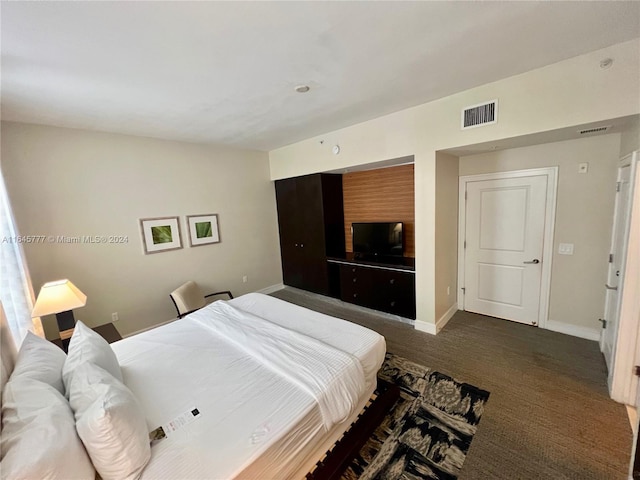 bedroom with visible vents and baseboards
