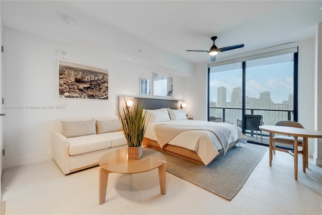 bedroom with access to exterior, ceiling fan, floor to ceiling windows, and light tile patterned flooring