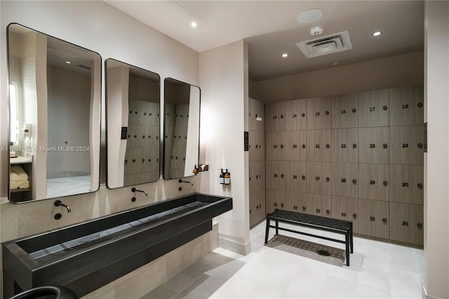 bathroom with a mail area, vanity, and tile patterned floors