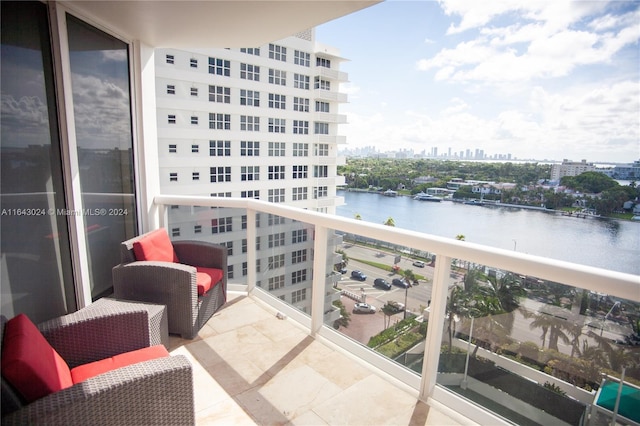 balcony featuring a water view