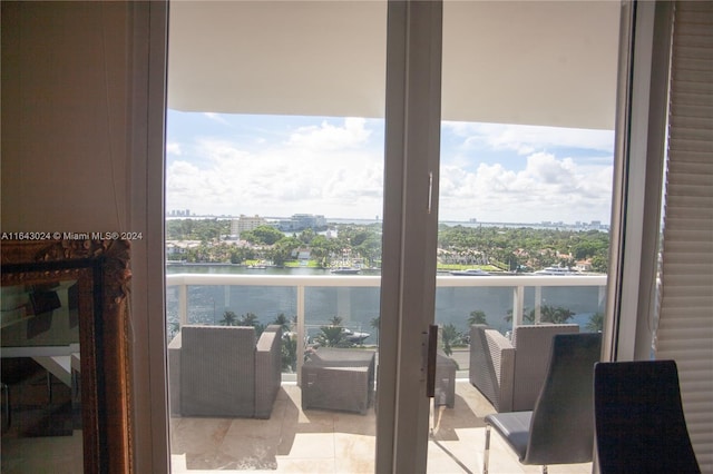 balcony featuring a water view