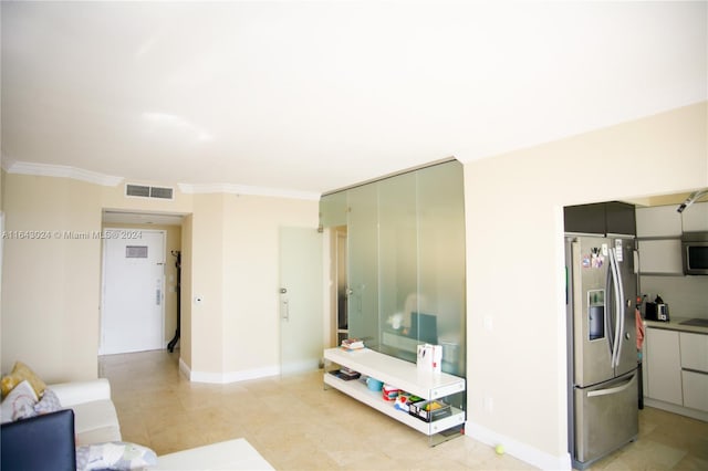 tiled living room featuring crown molding