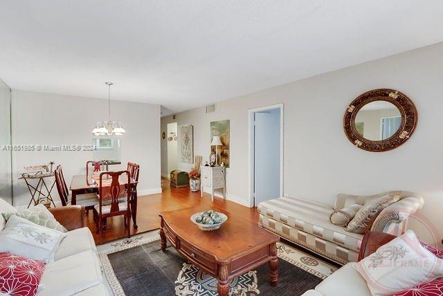 living room with an inviting chandelier