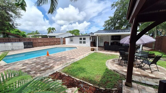 view of swimming pool featuring a patio area