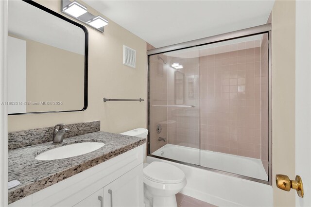 kitchen featuring white cabinets, appliances with stainless steel finishes, light tile patterned floors, and light stone countertops