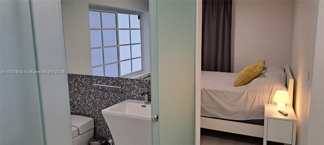 846 Michigan Ave Unit 101, Miami Beach, FL 33139 - bathroom with tile walls and healthy amount of natural light