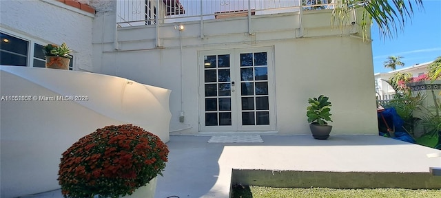 846 Michigan Ave Unit 101, Miami Beach, FL 33139 - doorway to property with stucco siding, a patio area, and french doors
