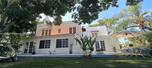 846 Michigan Ave Unit 101, Miami Beach, FL 33139 - back of house featuring french doors, stucco siding, and a yard