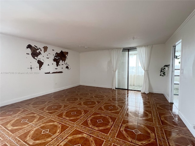 empty room featuring ornamental molding