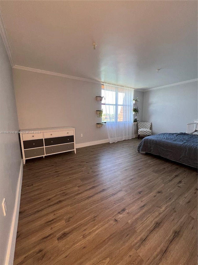 unfurnished bedroom with crown molding and dark hardwood / wood-style flooring