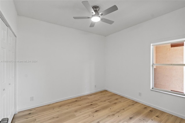 spare room featuring ceiling fan and light wood-type flooring