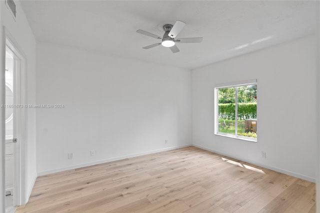 spare room with ceiling fan and light hardwood / wood-style floors